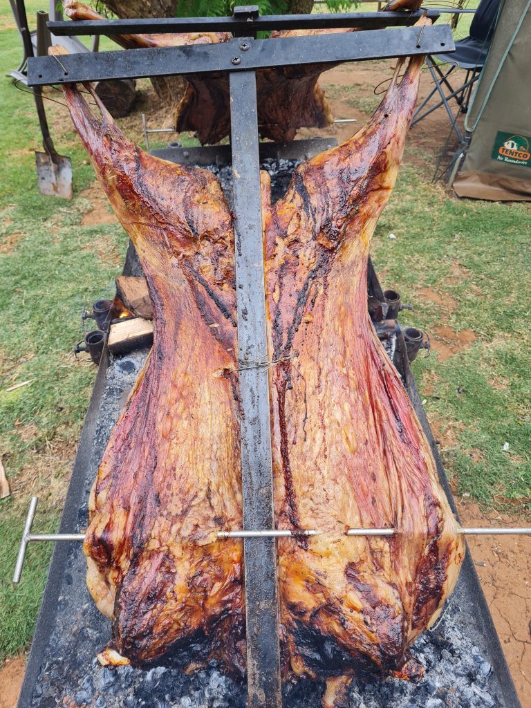 Whole lamb on the spit at a spitbraai catering event in Gqeberha by Pedros Asado