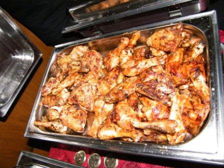 Flame-grilled chicken quarters served at a Pedros Asado spitbraai catering event in Gqeberha