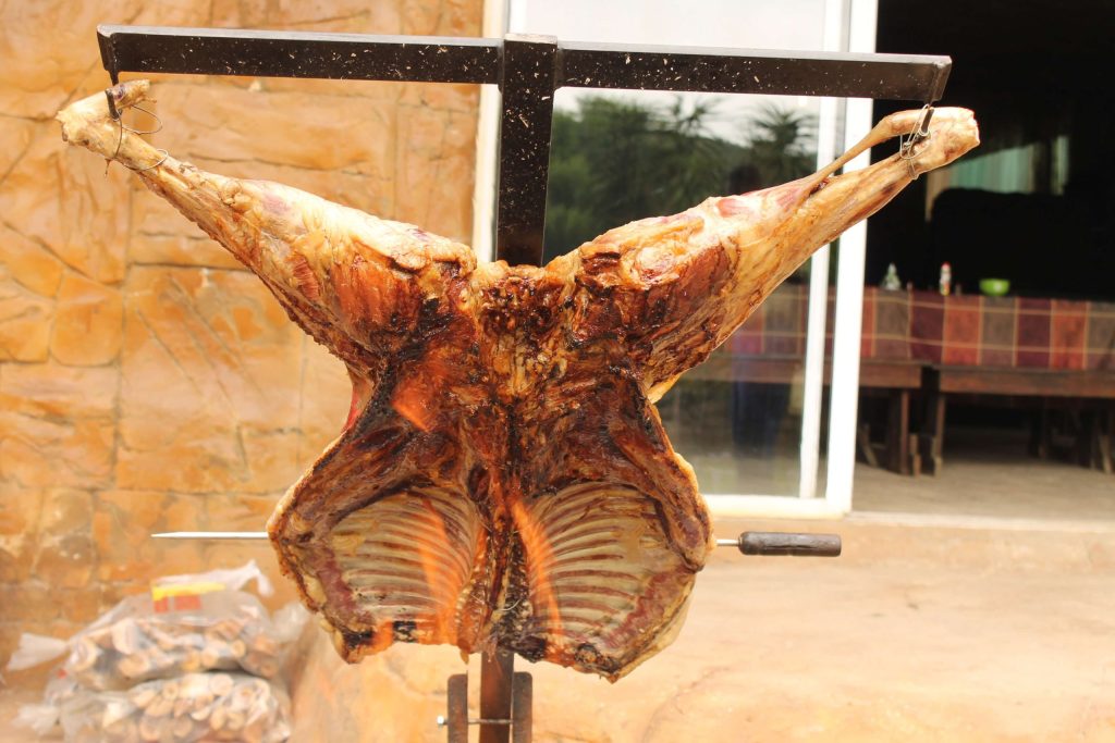 Whole lamb prepared for spit-braai roasting at a Pedros Asado catering event